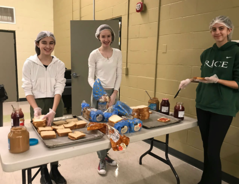 Left to Right: Marissa Cross, Rafaella Bird Matarazzo, and Adeline Eldred making peanut butter and jelly sandwiches (Photo/RMHS Instagram)
