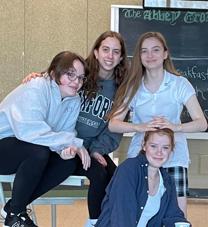 Cast members (from left to right) Logan Forcier, Addy Eldred, Kate Walco, and Miriam Callan smile at rehearsal. (Photo/ Markus Hammer)