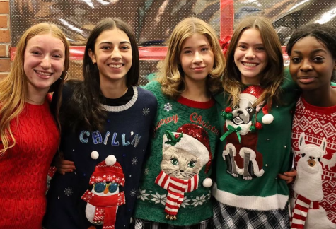 Ugly Christmas sweater day. From left to right, Mary Moyer, Kate Larkin, Whitney Williams, Sophia Chan, and Privany Soungha. (Photo/Megan Shrestha)