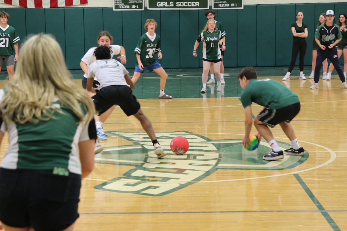 Students racing to grab the balls in dodgeball at the Spring 2023 Pep Rally. (Photo/Steffen Parker)