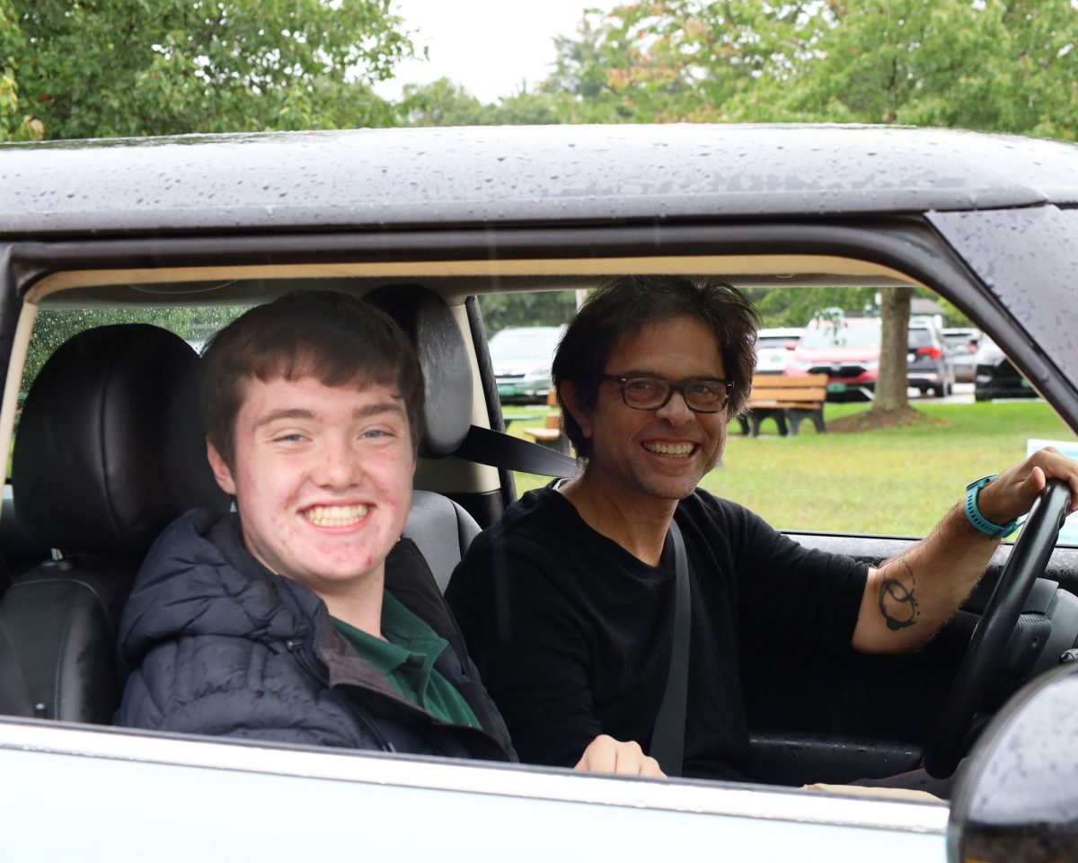 Teacher Darren Clas in his famous MINI Cooper during a physics lab. (Photo/rmhsvt)