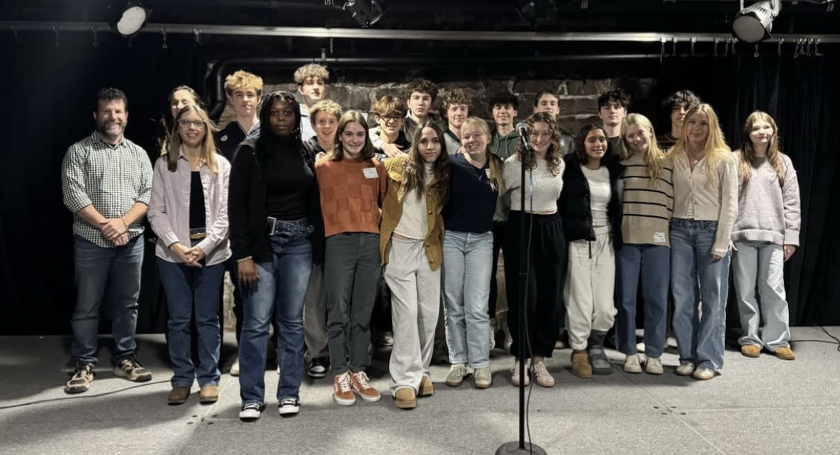 Students and faculty on the stage at the Flynn Space. (Photo/Larissa Hebert)