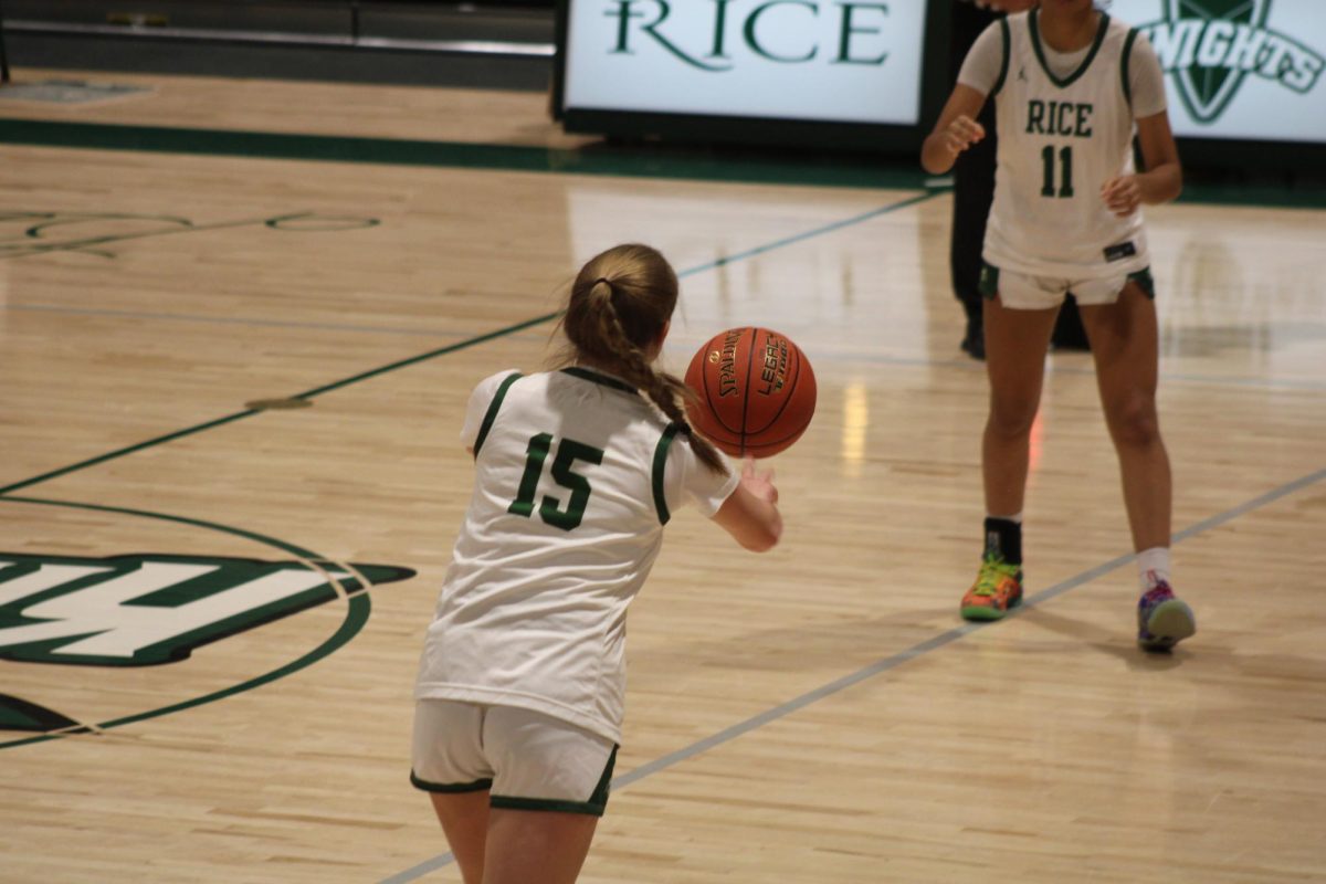 Sophomore Sara Guidice passes the ball to Junior Alexis Menard-O'Neil in the first quarter.