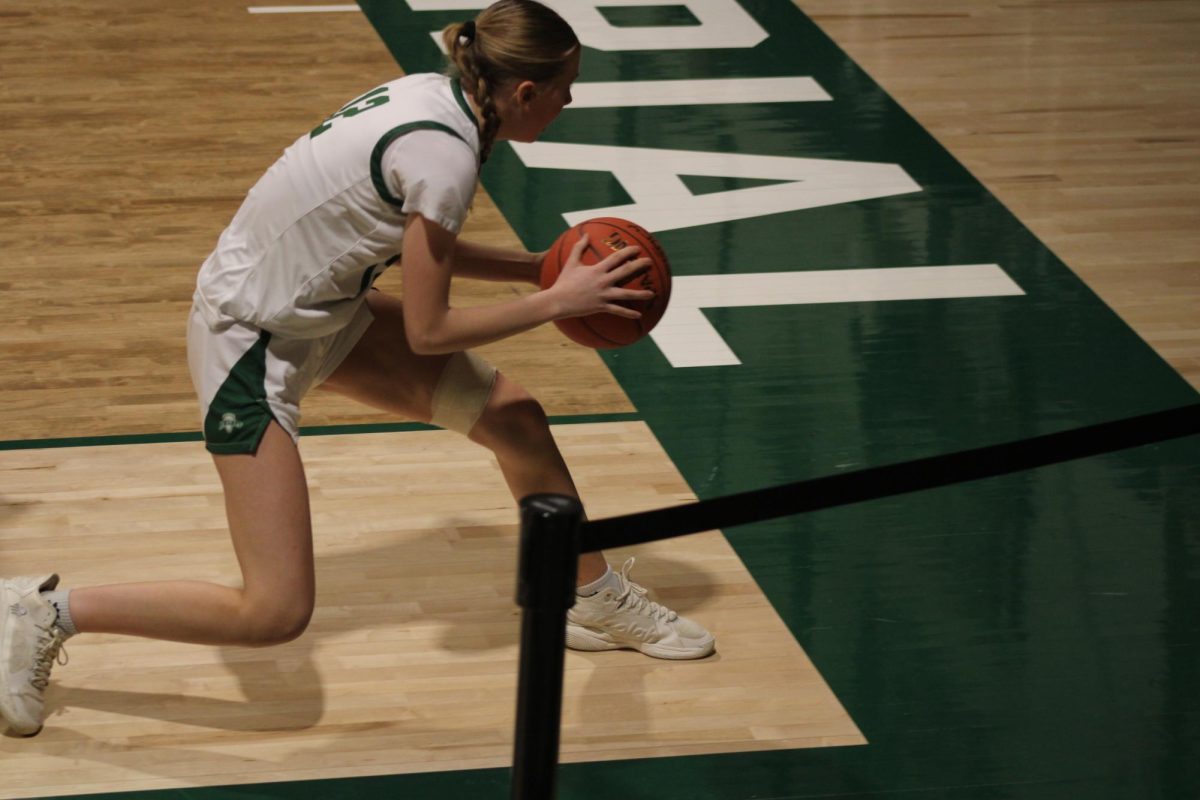 Sophomore Savannah Nelson saves the ball from going out of bounds, February 17, 2026.