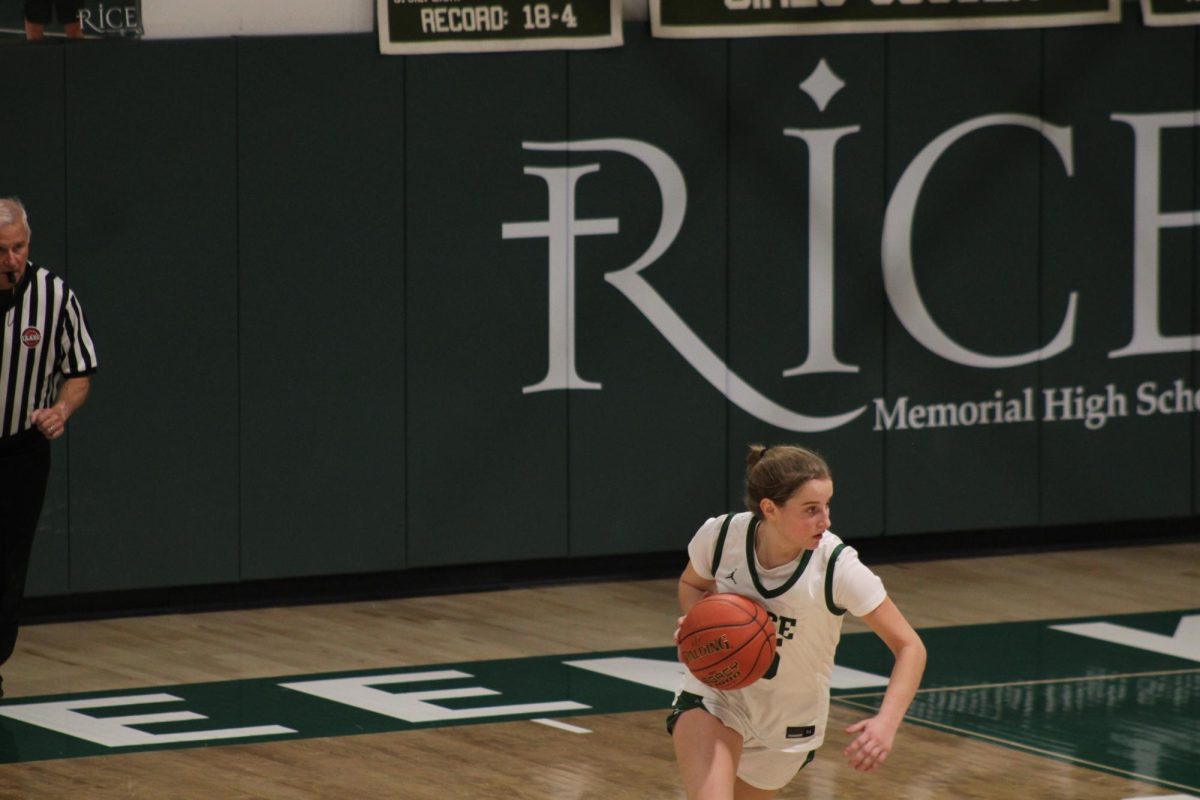Sophomore Sara Guidice takes the ball out for the Rice Green Knights against the St. Johnsbury Hilltoppers.