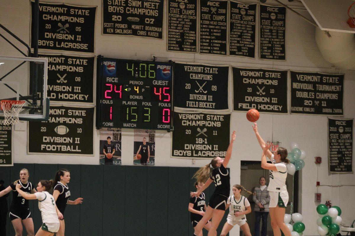 Senior Mary Biggins shoots a three pointer at her Senior Game against teh St. Johnsbury Hilltoppers.
