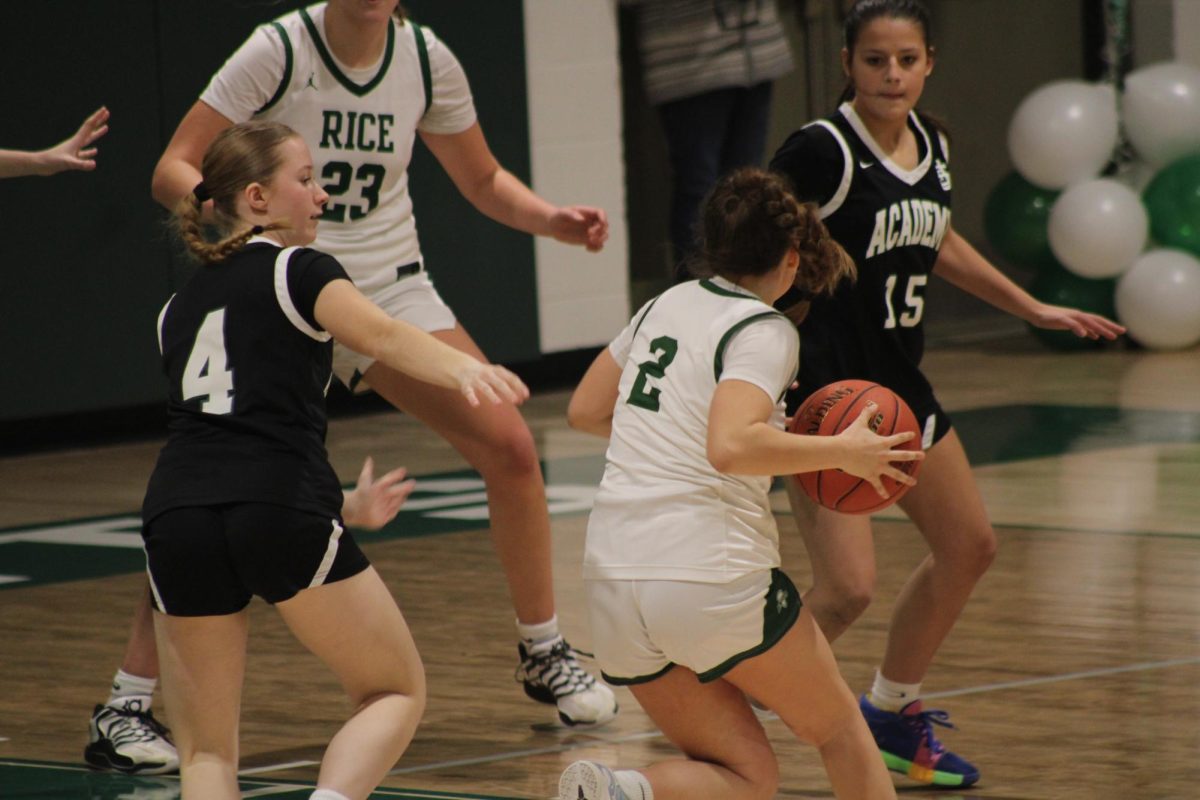 Senior Bayleigh Clark makes a drive to the hoop at her Senior Game.